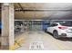 Spacious parking garage offering secure parking options and storage solutions in a well-lit area at 4875 S Monaco St # 303, Denver, CO 80237