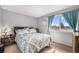 Bedroom with comfortable bed, dresser and a window at 8746 Carr Loop, Arvada, CO 80005