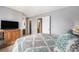 Bedroom with neutral walls and carpet, featuring a comfortable bed and TV at 8746 Carr Loop, Arvada, CO 80005