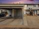 Exterior elevation showing carport and entrance to home in a townhome-style property at 8746 Carr Loop, Arvada, CO 80005