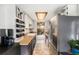 Galley kitchen with updated stainless steel appliances and butcher block countertops at 8746 Carr Loop, Arvada, CO 80005