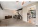 Cozy living room featuring carpet flooring and staircase to the upper level at 8746 Carr Loop, Arvada, CO 80005