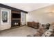 Relaxing living room with fireplace, TV, and a cozy couch with natural lighting at 8746 Carr Loop, Arvada, CO 80005