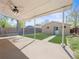 Spacious backyard featuring a covered patio, well-maintained lawn, and detached garage at 1987 S Downing St, Denver, CO 80210