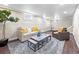 Finished basement featuring a cozy seating area, recessed lighting, and a large rug at 1987 S Downing St, Denver, CO 80210