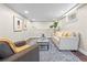 Finished basement featuring a comfortable seating area, neutral decor, and ample lighting at 1987 S Downing St, Denver, CO 80210