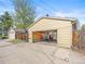 Detached garage with an open door, offering ample space and potential for customization at 1987 S Downing St, Denver, CO 80210