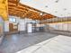 Large garage interior with exposed rafters, good lighting and plenty of storage space at 1987 S Downing St, Denver, CO 80210
