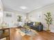 Bright living room featuring hardwood floors, ample natural light and contemporary furnishings at 1987 S Downing St, Denver, CO 80210
