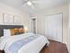Comfortable bedroom featuring hardwood floors, a ceiling fan and a closet at 1987 S Downing St, Denver, CO 80210
