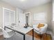 Bright home office with hardwood floors, neutral walls, closet and an accent chair at 1987 S Downing St, Denver, CO 80210