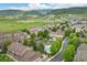 Scenic aerial view of the townhome community with mountain views and landscaped surroundings at 12919 W Burgundy Dr, Littleton, CO 80127