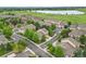 Scenic aerial view of the well-maintained townhome community and nearby lake at 12919 W Burgundy Dr, Littleton, CO 80127
