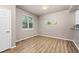 Bright dining area with hardwood floors, large window, and neutral paint is perfect for comfortable meals at 12919 W Burgundy Dr, Littleton, CO 80127