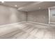 Large, carpeted finished basement with recessed lighting and neutral color scheme at 12919 W Burgundy Dr, Littleton, CO 80127