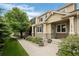 Charming townhome with stone accents, well-maintained landscaping, and inviting walkway at 12919 W Burgundy Dr, Littleton, CO 80127