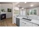 Stylish kitchen with granite countertops, stainless steel appliances, and open shelving at 12919 W Burgundy Dr, Littleton, CO 80127