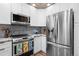 Modern kitchen featuring stainless steel appliances and ample counter space at 12919 W Burgundy Dr, Littleton, CO 80127