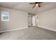 The main bedroom features carpet, ceiling fan, and an ensuite bathroom at 12919 W Burgundy Dr, Littleton, CO 80127