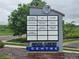 Signage for the Coal Mine Centre displaying a directory of businesses at 12919 W Burgundy Dr, Littleton, CO 80127