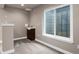 Finished basement featuring an egress window, and a wet bar area at 12919 W Burgundy Dr, Littleton, CO 80127