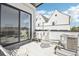 Relax on this stylish patio with outdoor seating, modern AC unit and sliding glass door at 1286 Raleigh St, Denver, CO 80204