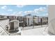 Enjoy the views from this open-air deck featuring a modern patio set and AC unit at 1286 Raleigh St, Denver, CO 80204