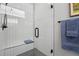 Bathroom features a glass enclosed shower, with vertical tiling and a tiled bench at 1286 Raleigh St, Denver, CO 80204
