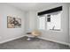 Bedroom with neutral colors, carpeted floors, and a large window at 1286 Raleigh St, Denver, CO 80204