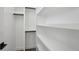 Walk-in closet provides ample storage space with built-in shelving and rods at 1286 Raleigh St, Denver, CO 80204