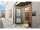 A welcoming entryway featuring a stylish doormat, modern mailbox, and sleek design elements at 1286 Raleigh St, Denver, CO 80204