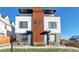 Modern townhome showcasing a striking two-story elevation with unique architectural details and inviting entryways at 1286 Raleigh St, Denver, CO 80204