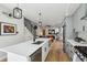 Modern kitchen with stainless steel appliances, sleek countertops, and an open layout leading to living space at 1286 Raleigh St, Denver, CO 80204