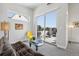 Comfortable living room with access to a rooftop patio, modern decor and sliding glass door at 1286 Raleigh St, Denver, CO 80204
