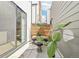 Outdoor patio featuring a table and chairs, potted plants, and a privacy fence at 1286 Raleigh St, Denver, CO 80204