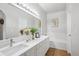 Bright bathroom features a soaking tub, double sink vanity with marble countertops at 1441 S Ulster St, Denver, CO 80231