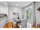 Dining room showcasing a table set for four near glass patio doors at 1441 S Ulster St, Denver, CO 80231
