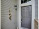 Stylish front door with side light and decorative bells at 1441 S Ulster St, Denver, CO 80231