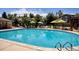 Sparkling community pool with lounge chairs and umbrellas, perfect for relaxation and recreation at 1441 S Ulster St, Denver, CO 80231