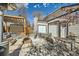 Backyard featuring a patio area with outdoor dining set and pergola at 1640 Harrison St, Denver, CO 80206