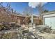 Spacious backyard patio with a hot tub, pergola, outdoor seating, and ample space for outdoor enjoyment at 1640 Harrison St, Denver, CO 80206