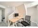 Cozy basement office space with a desk, modern office chair, and carpeted floors for a comfortable work environment at 1640 Harrison St, Denver, CO 80206