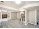 Finished basement with neutral carpet, glass block accent, and recessed lighting at 1640 Harrison St, Denver, CO 80206