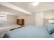 Spacious basement bedroom featuring a dresser and a window at 1640 Harrison St, Denver, CO 80206