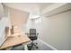 Basement office space boasts a modern desk, comfortable chair, and neutral decor for a serene workspace at 1640 Harrison St, Denver, CO 80206