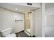 Modern bathroom with glass-enclosed shower and tile surround at 1640 Harrison St, Denver, CO 80206
