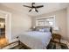Comfortable bedroom with a decorative patterned area rug, full bed, side tables, and natural light from an exterior window at 1640 Harrison St, Denver, CO 80206