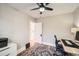 Cozy bedroom with a ceiling fan, a window for natural light, and hardwood floors at 1640 Harrison St, Denver, CO 80206