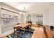 Dining room featuring hardwood floors, modern lighting, and seamless flow to living spaces at 1640 Harrison St, Denver, CO 80206