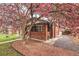 Quaint brick home with mature landscaping and a charming entryway, creating a welcoming atmosphere at 1640 Harrison St, Denver, CO 80206